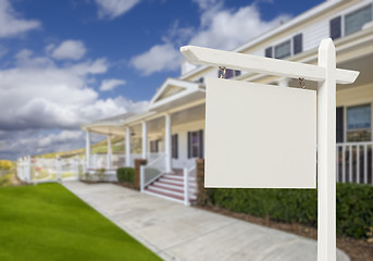 Image showing Blank Real Estate Sign in Front of New House 