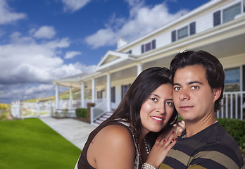 Image showing Happy Hispanic Young Couple in Front of Their New Home