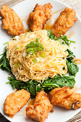 Image showing Chicken Wings with Noodles and Spinach