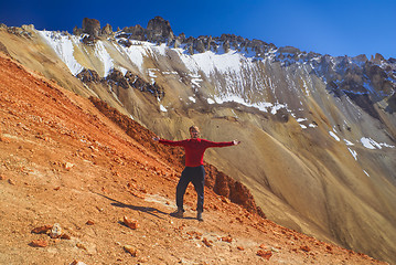 Image showing Hiker on colored mountain