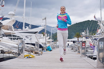 Image showing woman jogging in marina