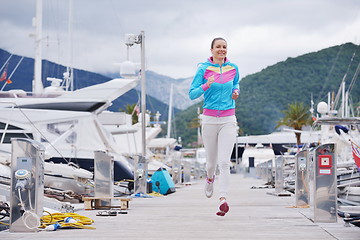 Image showing woman jogging in marina