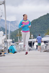 Image showing woman jogging in marina
