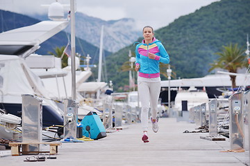 Image showing woman jogging in marina