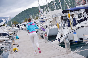 Image showing woman jogging in marina