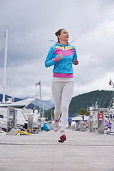 Image showing woman jogging in marina