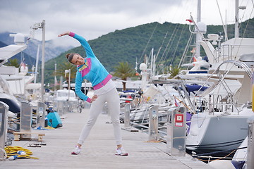 Image showing woman jogging in marina