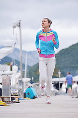 Image showing woman jogging in marina