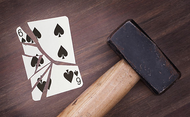 Image showing Hammer with a broken card, six of spades