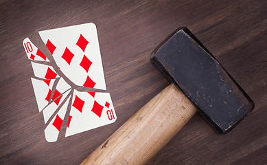 Image showing Hammer with a broken card, ten of diamonds