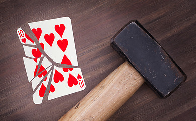 Image showing Hammer with a broken card, ten of hearts