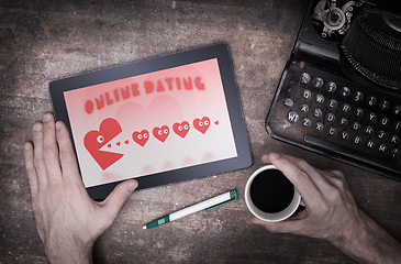 Image showing Online dating on a tablet