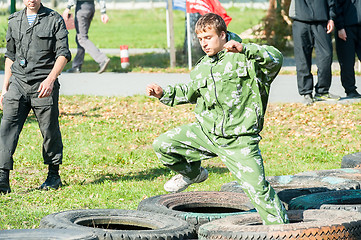 Image showing Boy participates in militarized relay