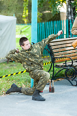 Image showing Boy throws hand grenade