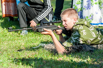 Image showing Young man took aim with air gun