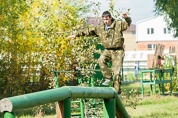 Image showing Boy participates in militarized relay