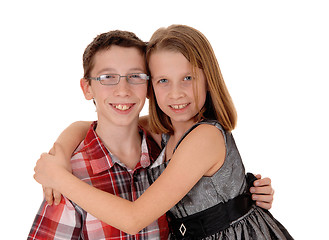 Image showing Brother and sister hugging.