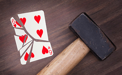 Image showing Hammer with a broken card, six of hearts