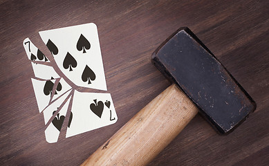 Image showing Hammer with a broken card, seven of spades