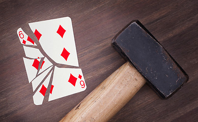 Image showing Hammer with a broken card, six of diamonds