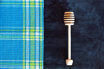 Image showing honey stick and tablecloth