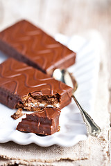 Image showing dark chocolate cakes and spoon 