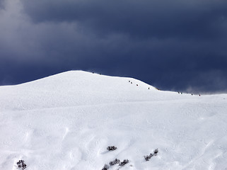 Image showing Off-piste slope and storm gray sky in bad weather day