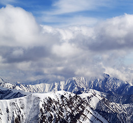 Image showing Winter snowy mountains and cloudy sky