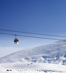 Image showing Gondola lift and ski slope at nice sun day