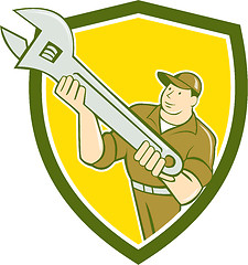 Image showing Mechanic Presenting Spanner Wrench Shield Cartoon