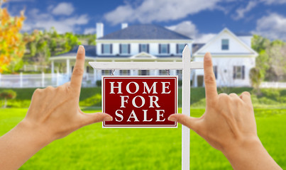 Image showing Hands Framing For Sale Real Estate Sign and New House