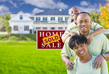 Image showing African American Family In Front of Sold Sign and House