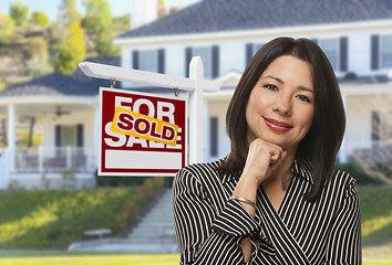 Image showing Hispanic Woman in Front of Sold Sign and House