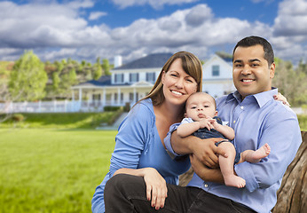 Image showing Happy Mixed Race Young Family in Front of House