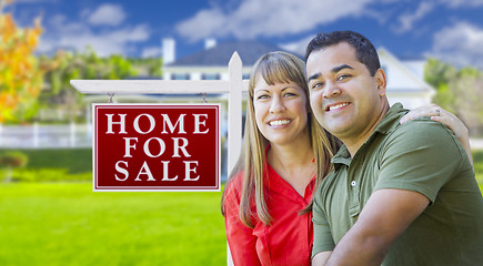 Image showing Couple in Front of For Sale Sign and House