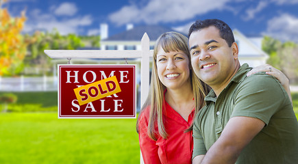 Image showing Couple in Front of Sold Real Estate Sign and House