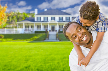 Image showing Mixed Race Father and Son In Front of House