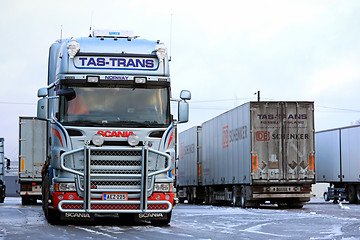 Image showing Fleet of Scania Trailer Trucks on Icy Yard