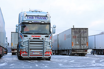 Image showing Fleet of Scania Trailer Trucks on Wintry Icy Yard