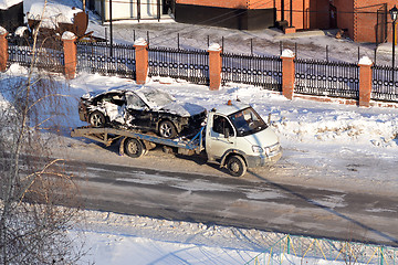 Image showing transportation of the broken car in the winter.