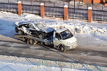 Image showing transportation of the broken car in the winter.