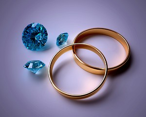 Image showing wedding rings and blue gems