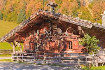 Image showing Hut in the village center on maple back