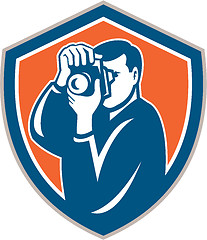 Image showing Photographer Aiming Camera Shield Retro