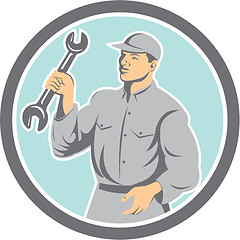 Image showing Mechanic Holding Spanner Wrench Circle Retro