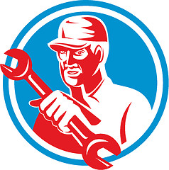 Image showing Mechanic Holding Spanner Wrench Circle Retro