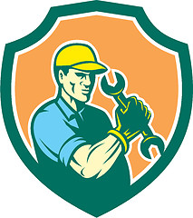 Image showing Mechanic Holding Spanner Wrench Shield Retro