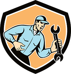 Image showing Mechanic Shouting Holding Spanner Wrench Shield Retro