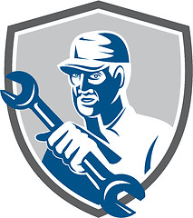 Image showing Mechanic Holding Spanner Wrench Shield Retro