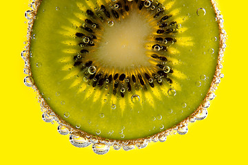 Image showing Kiwi slice with bubbles